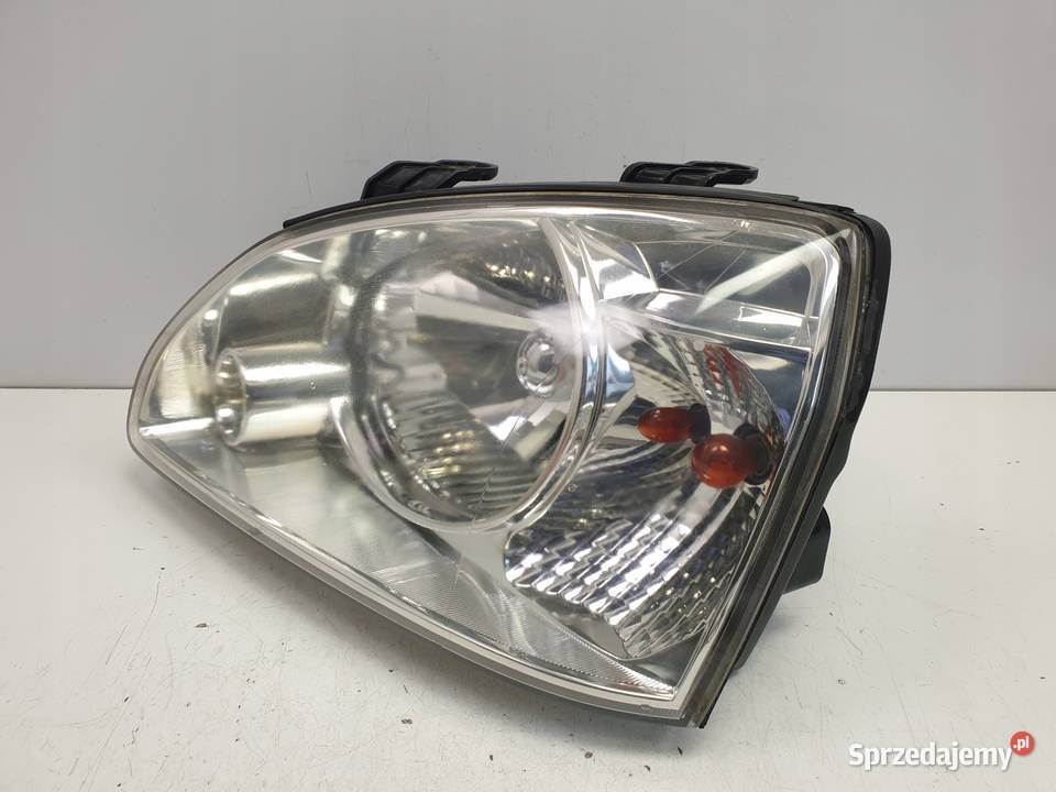 Kia Carens II PRZEDNIA LAMPA LEWA lewy przód Janów