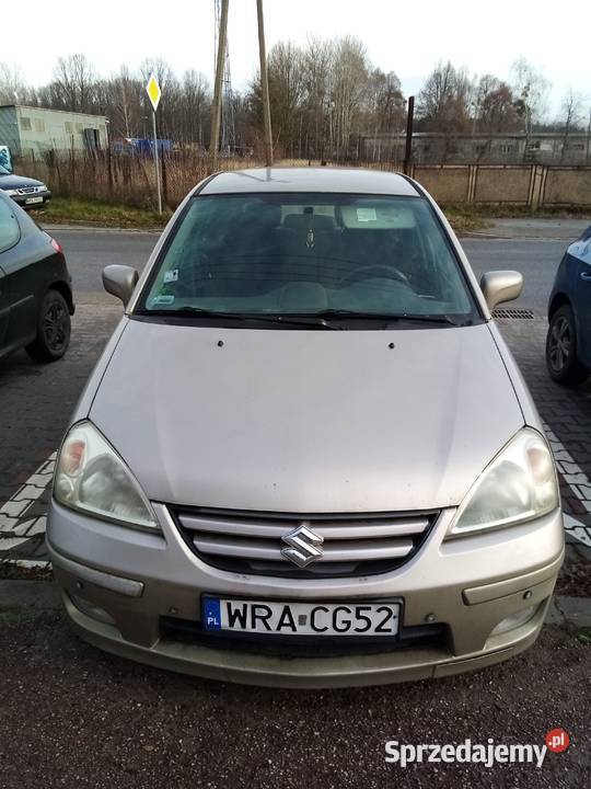 Suzuki Liana chatchback beżowy metal 16 Benzyna Pionki