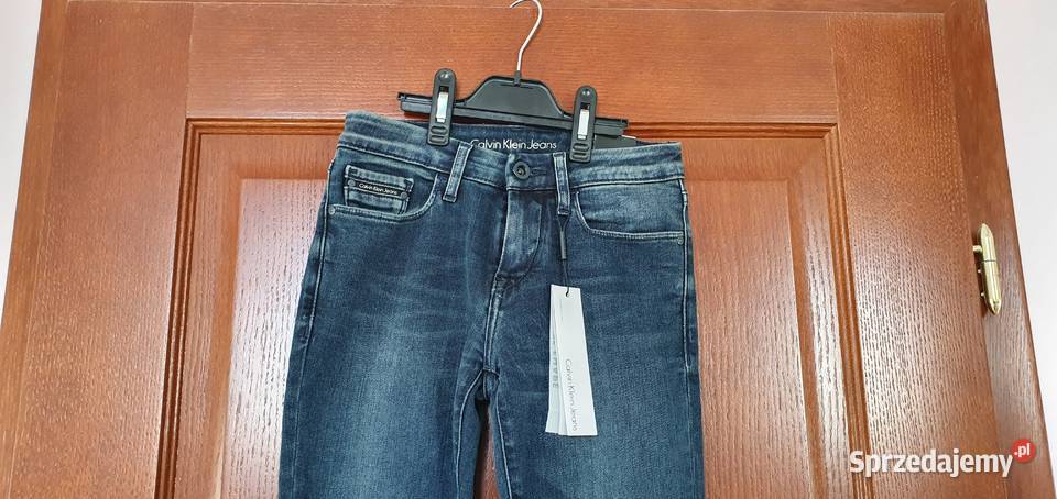 Nowe spodnie damskie Calvin Klein Jeans W25 L32 Spodnie Bibice