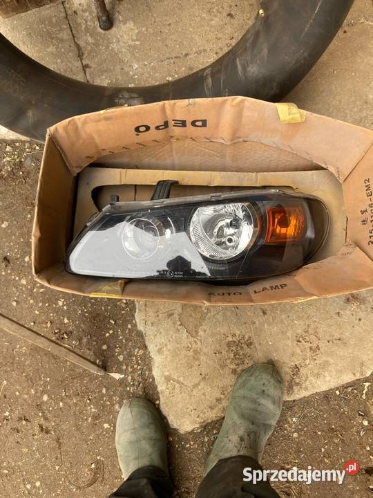 Reflektor lewy Nissan Almeria depo 2151196l Ślęzany