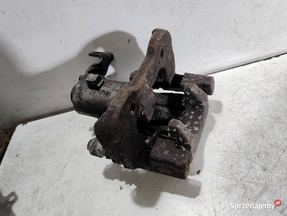 ZACISK HAMULCOWY LEWY TYŁ RENAULT SCENIC II 20 osobowe
