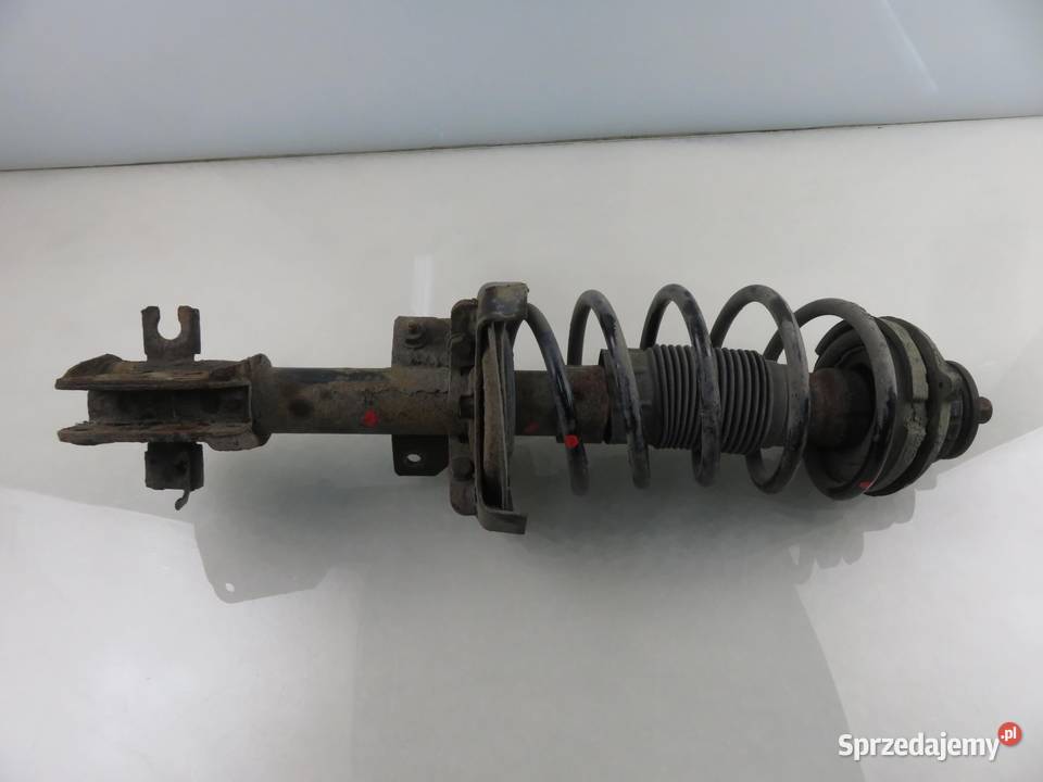 MCPERSON LEWY PRZEDNI FIAT STILO 16 16V 103 182 Części samochodowe