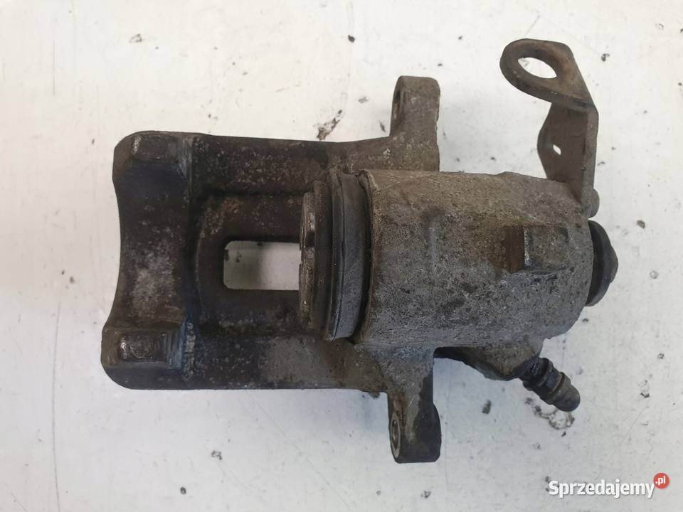 Skoda Octavia I ZACISK HAMULCOWY lewy TYŁ TYLNY osobowe Janów