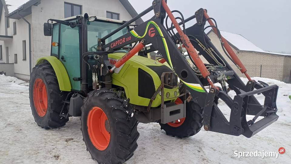 Claas Axos 320 z ładowaczem czołowym Faucheux