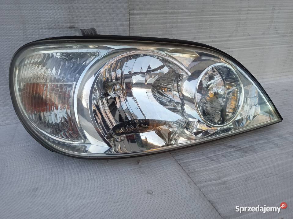 Kia Carnival 1 I lampa przednia prawa reflektor Sieradz