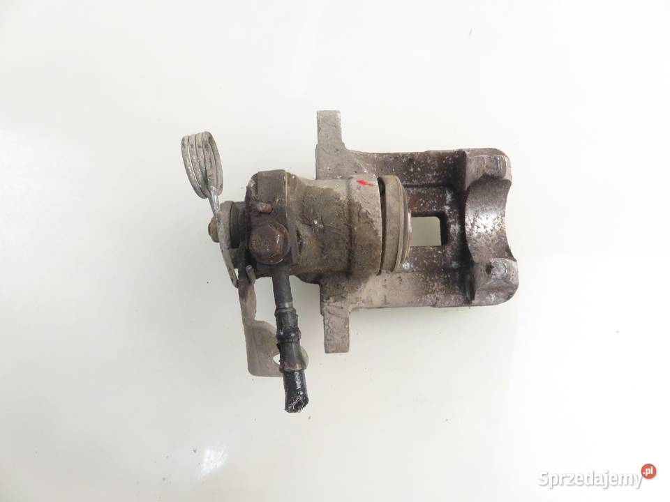 ZACISK PRAWY TYŁ VW PASSAT B5 19 TDI