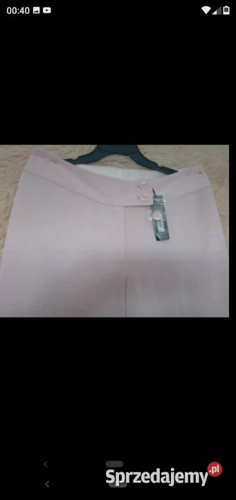 Nowe eleganckie spodnie pudrowy róż szerokie Bez wzoru