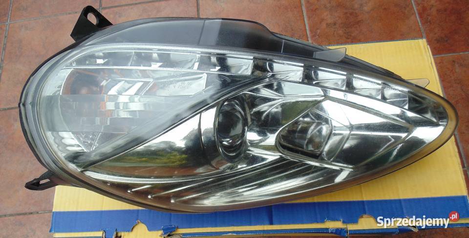 REFLEKTOR LAMPA PRZEDNIA FIAT GRANDE PUNTO Piła
