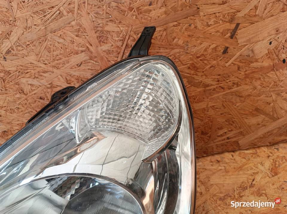 LAMPA LEWY PRZÓD REFLEKTOR EU 33150SCAYG021M1 osobowe Nowy Tomyśl