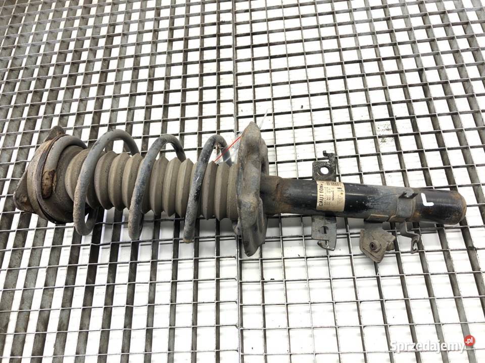 AMORTYZATOR LEWY PRZÓD ZE SPRĘŻYNĄ NISSAN Amortyzatory