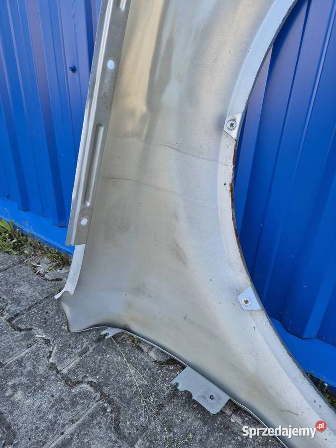 BŁOTNIK PRZÓD LEWY VW PASSAT B5 FL LA7W SREBRNY Części samochodowe Działoszyce