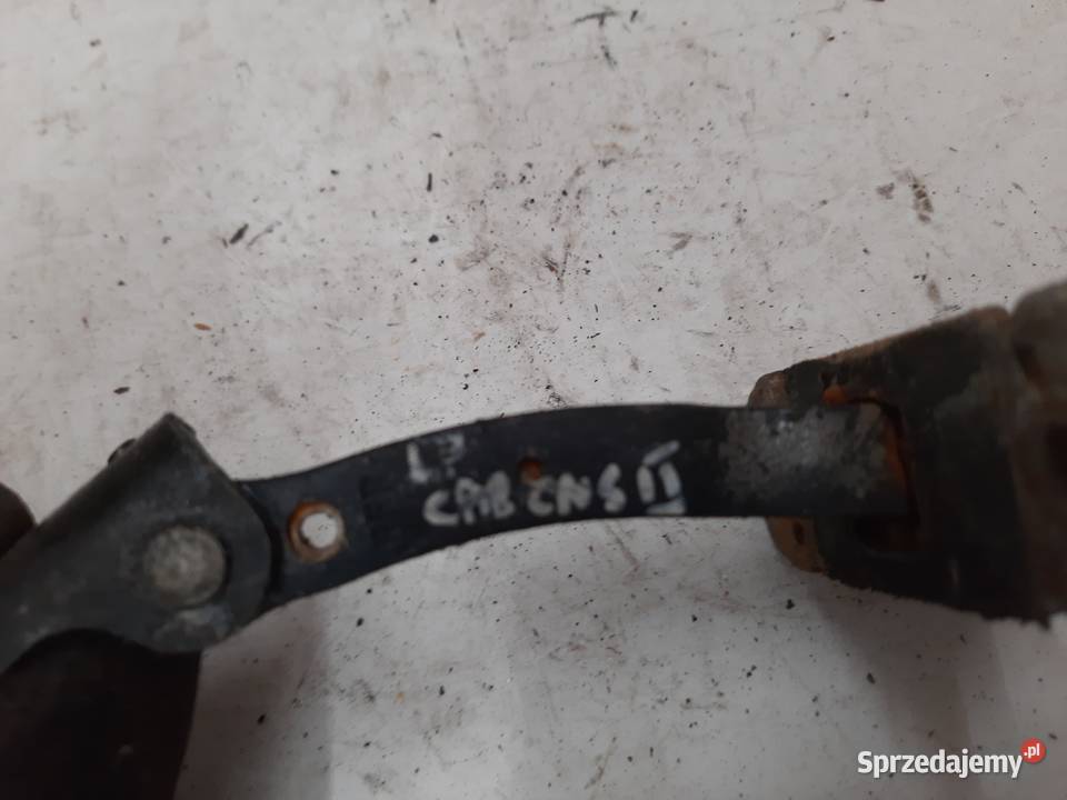 Kia Carens II Lewy Przedni ogranicznik drzwi Ksawerów