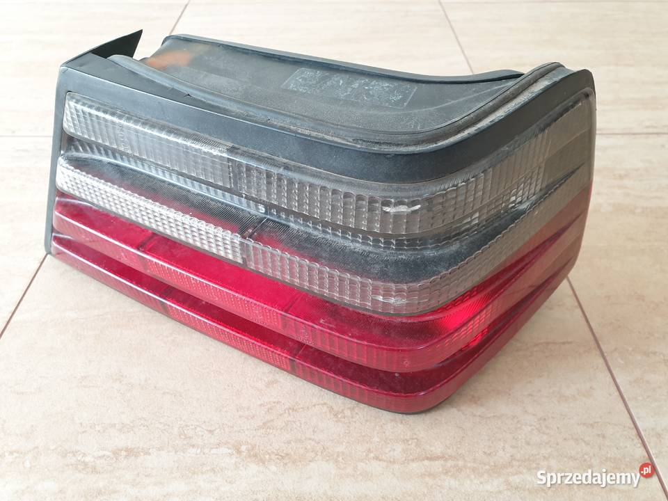Mercedes W124 sedan lampa prawy tył ciemna Hella Lampy tylne Legnica