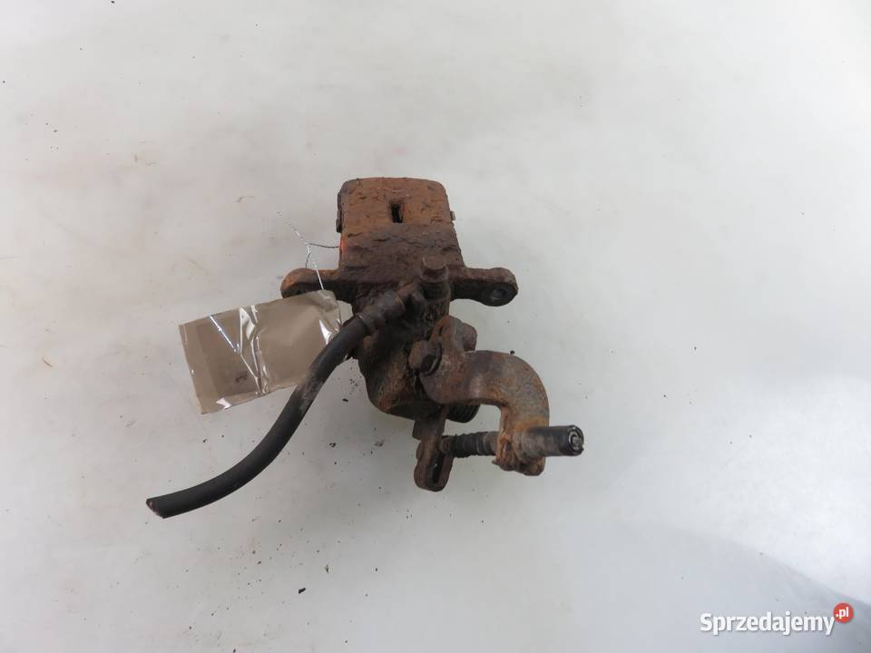 ZACISK LEWY TYŁ HYUNDAI COUPE II 20