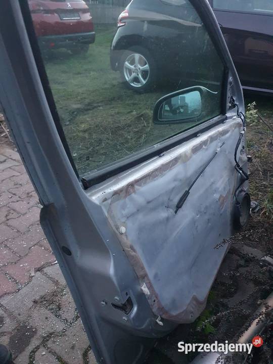 DRZWI LEWY PRZÓD OPEL ASTRA III H KOMBI SREBRNE