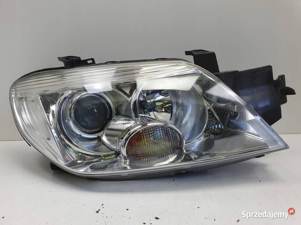LAMPA PRAWA Mitsubishi Outlander I 0306r Lampy przednie