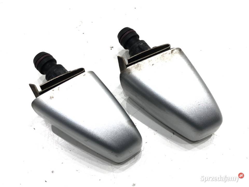 SPRYSKIWACZ REFLEKTORA LEWY PRZÓD BMW E83 Van