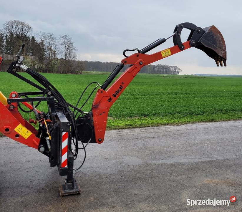 Ramie kopiące Bobcat Cat Ładowarka Motoryzacja Palikije Pierwsze