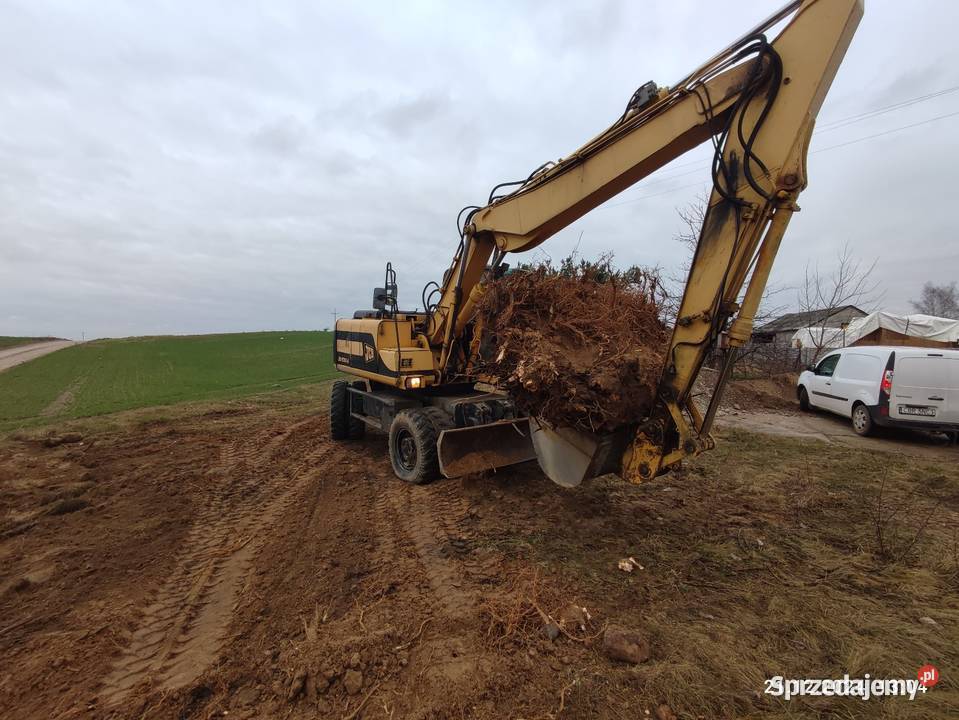 Koparka kołowa JCB js 130 w cat case komatsu Brodnica