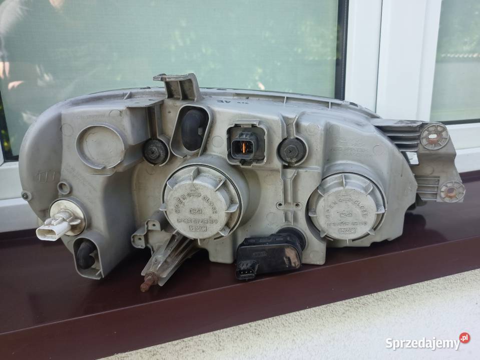 Kia Carnival 1 I lampa przednia lewa reflektor Lampy przednie łódzkie Sieradz