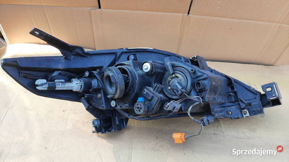 lampa przednia lewa soczewka Mazda V 0508r