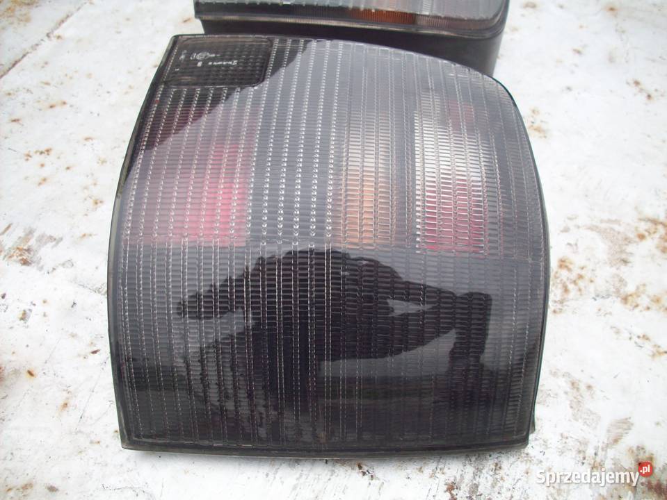 VW PASSAT B5 KOMBI lampy tył ciemne ori Iława