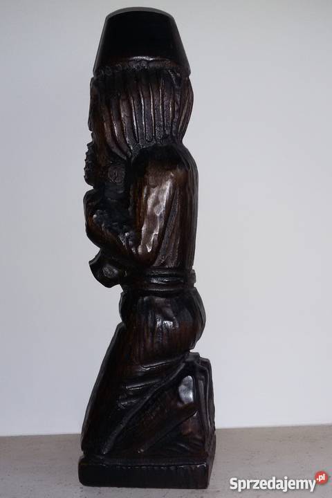 Ciekawa drewniana rzeźba muzyk saksofonista