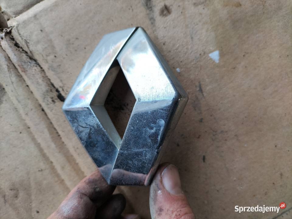 ZNACZEK EMBLEMAT 7700824625 RENAULT KANGOO Pozostałe Karoseria Kamień-Kolonia