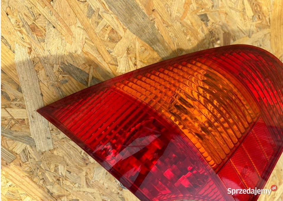 XS4X13405BC LAMPA LEWY TYŁ FORD FOCUS I SEDAN Lampy tylne Międzychód sprzedam