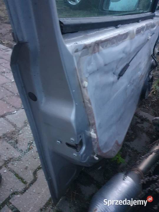 DRZWI LEWY PRZÓD OPEL ASTRA III H KOMBI SREBRNE Karoseria