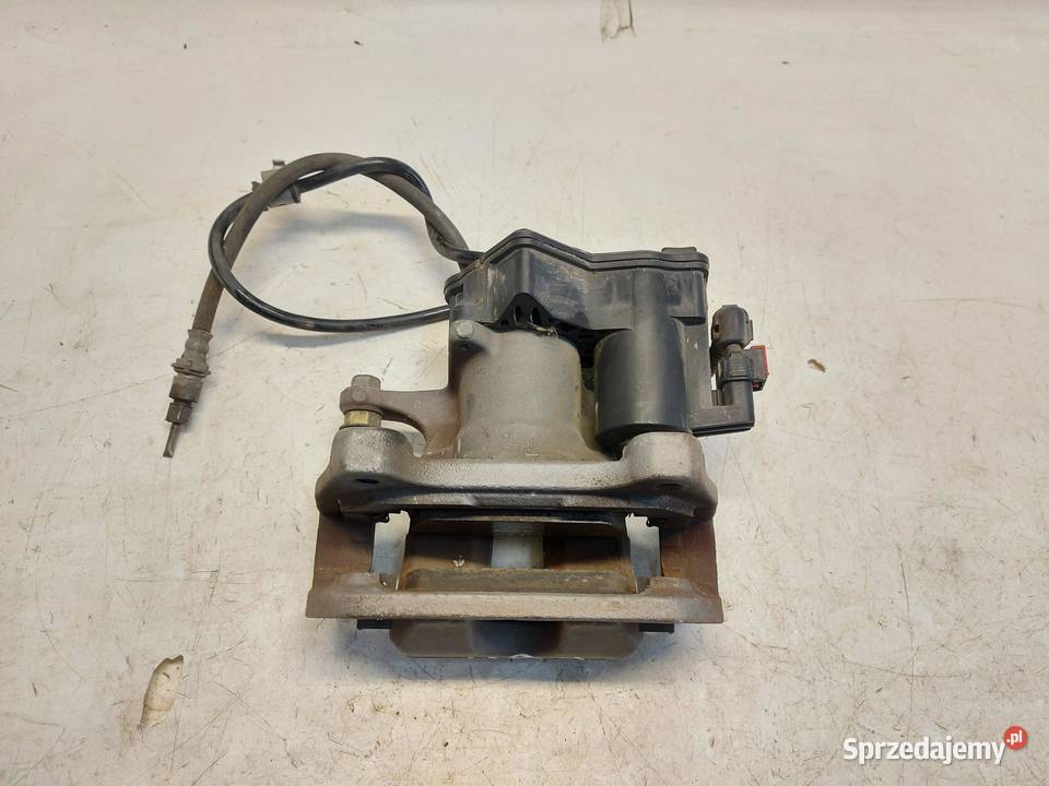 TESLA MODEL Y 2022r ZACISK HAMULCOWY LEWY TYŁ Zaciski i jarzma