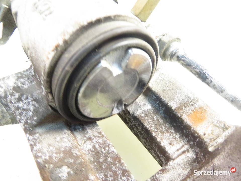 ZACISK LEWY TYŁ SEAT TOLEDO II 1M2 18 20V 125