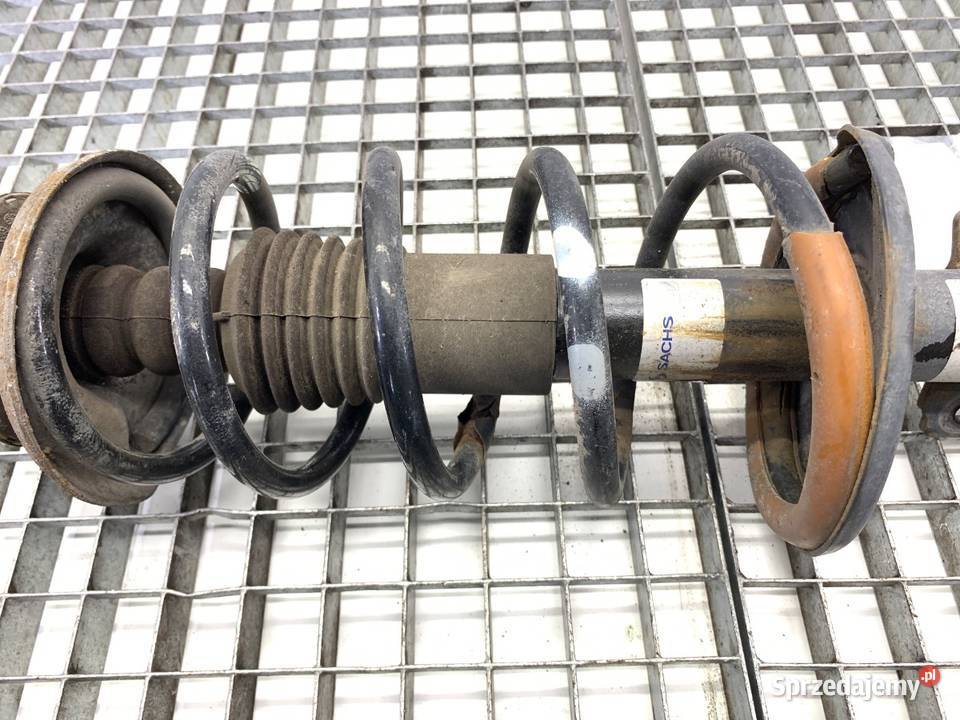 AMORTYZATOR LEWY PRZÓD ZE SPRĘŻYNĄ DACIA DUSTER