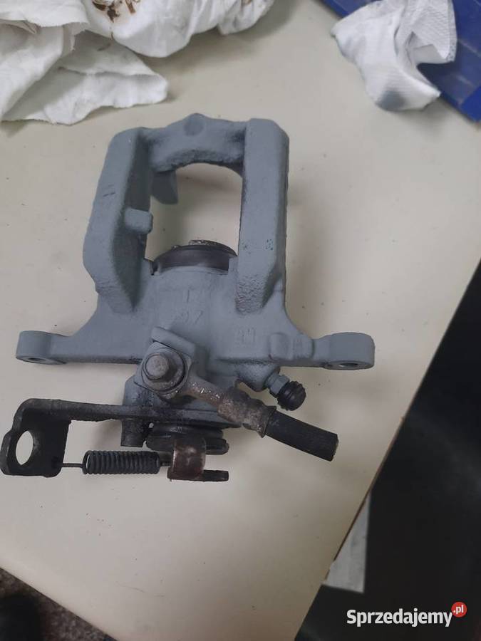 Zacisk lewy tył opel astra j Będzin
