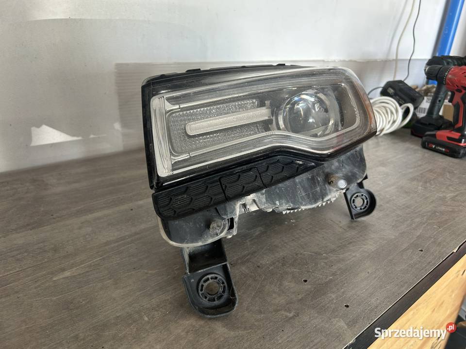 Przedni reflektor lewy BiXenon skrętny USA Jeep Bieździadka sprzedam