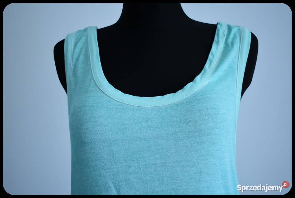 Miętowa bokserka mocno wycięta narzutka bluzka bez rękawa Płock