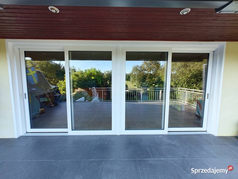 Sprzedaż i montaż okien drzwi parapetów rolet i usługi budowlane