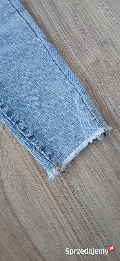 Jeansy z poszarpanymi nogawkami modne Spodnie kujawsko-pomorskie Grudziądz