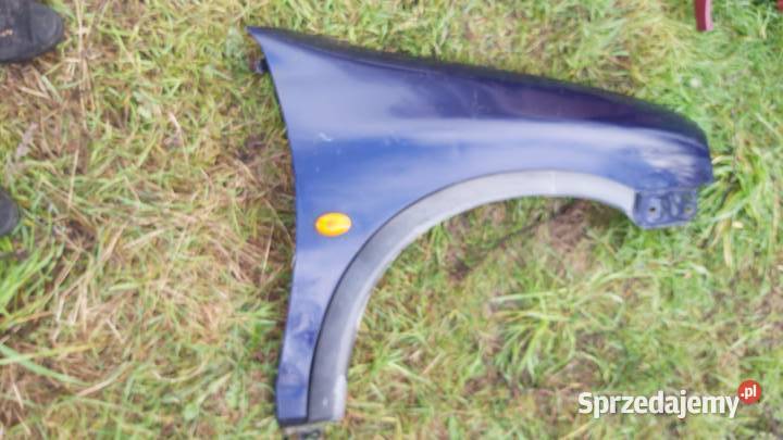 Blotnik przód prawy OPEL CORSA B granatowy