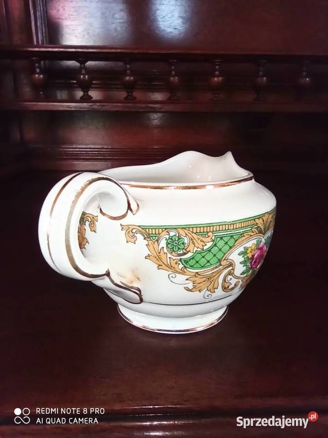 Mlecznik z kwiatami i zieloną dekoracją Vitreous