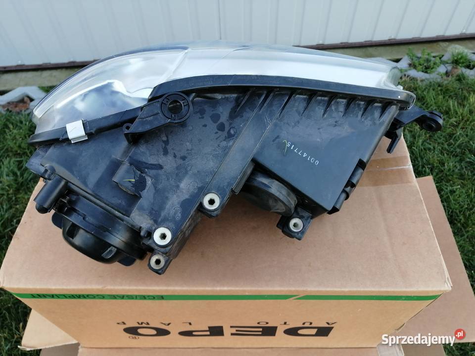Reflektor Vw Touran 1lift lewy biala ramka osobowe