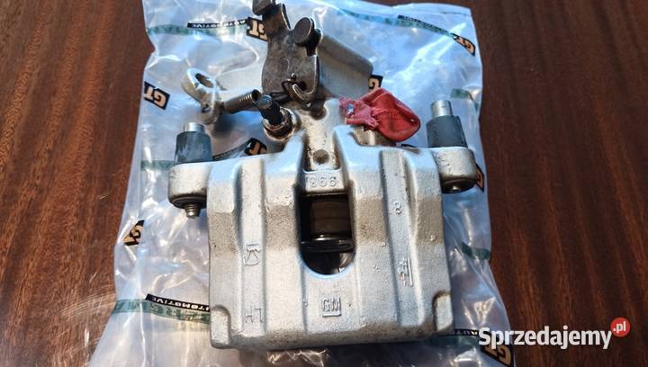 Oryginalny Zacisk GM hamulca LewyTył Opel Vectra osobowe Szczerbice