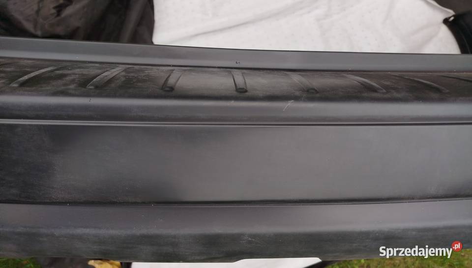 Zderzak tył Subaru Outback Legacy 57704AG11A