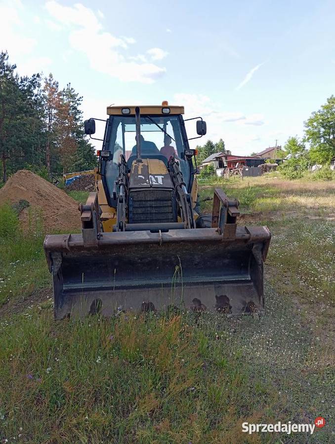 Usługi koparkoładowarką Cat 428D Pustków