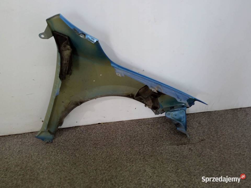 BŁOTNIK LEWY PRZÓD LQ5X LEKKO USZKODZONY Skoda