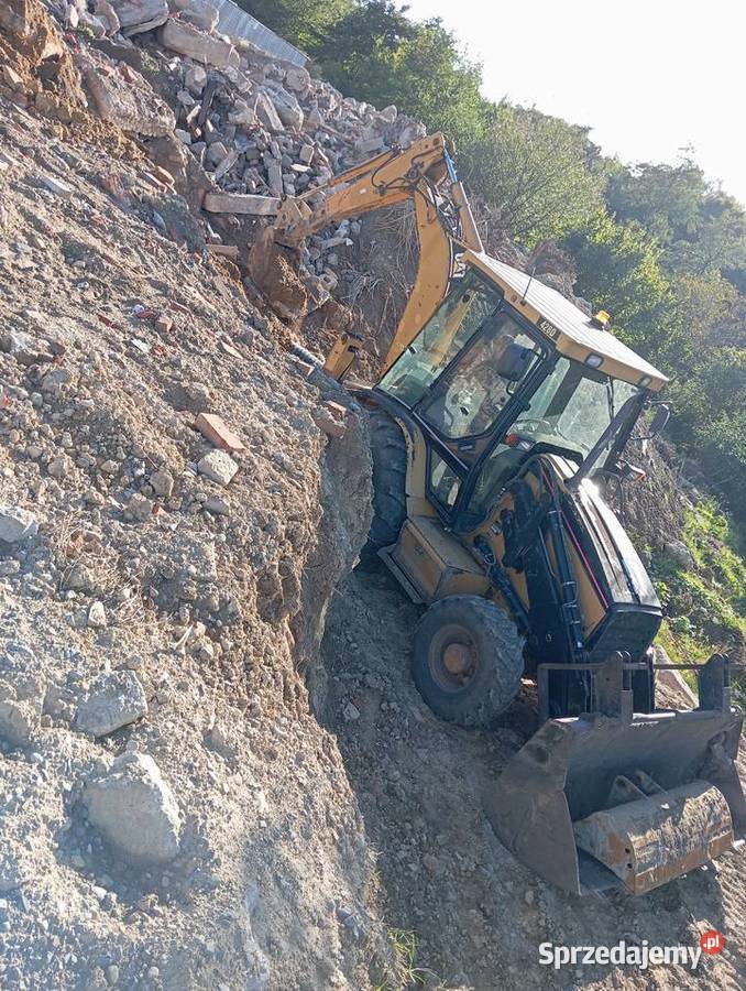 Usługi koparkoładowarką Cat 428D usługi budowlane