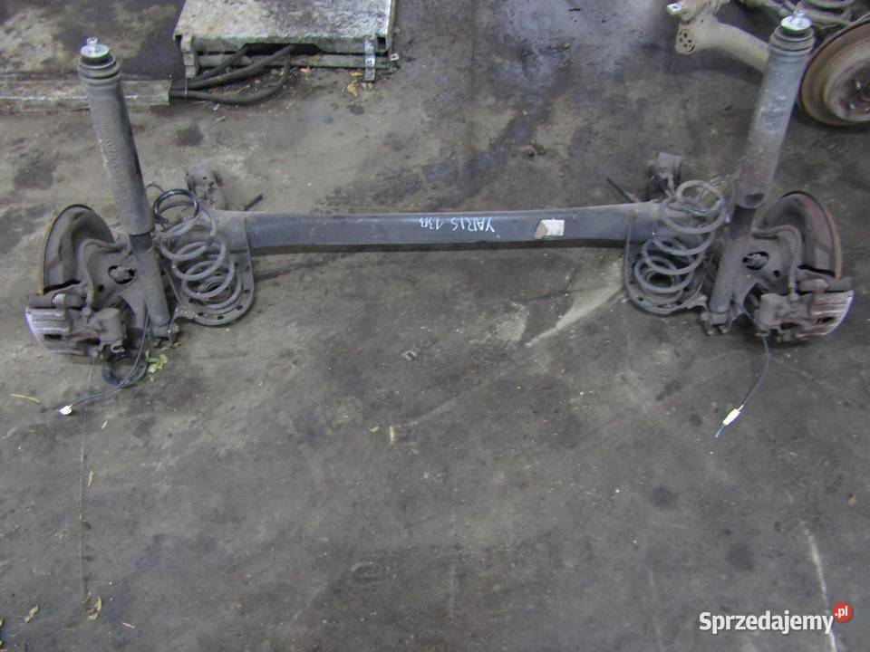 BELKA OŚ ZAWIESZENIA TYŁ TYLNA 13 VVTi TOYOTA Części samochodowe