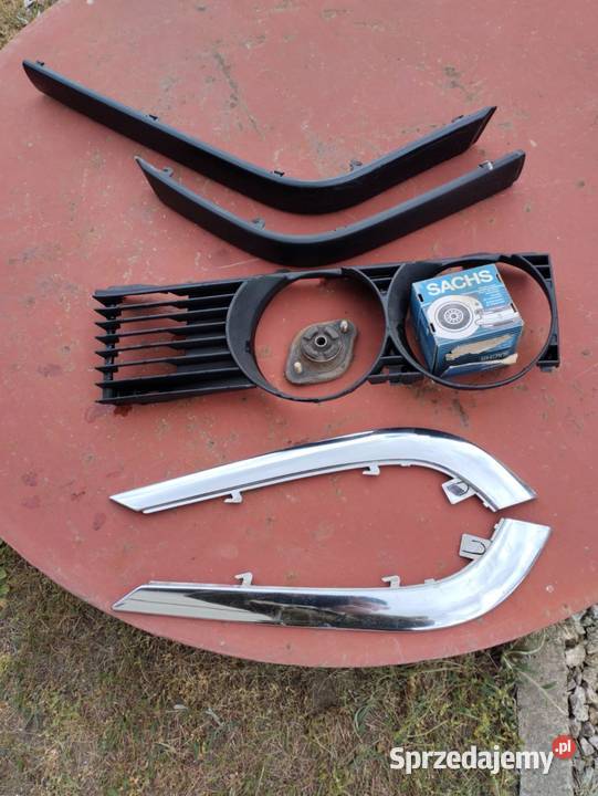 Części BMW e32 listwy łukowe i e36 boczne Rudy