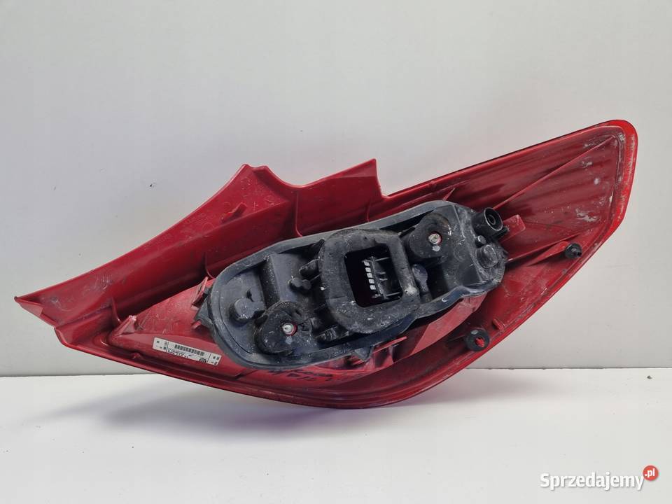 Opel Corsa D HTB 3D 0611r TYLNIA TYLNA LAMPA osobowe Oświetlenie Rudka