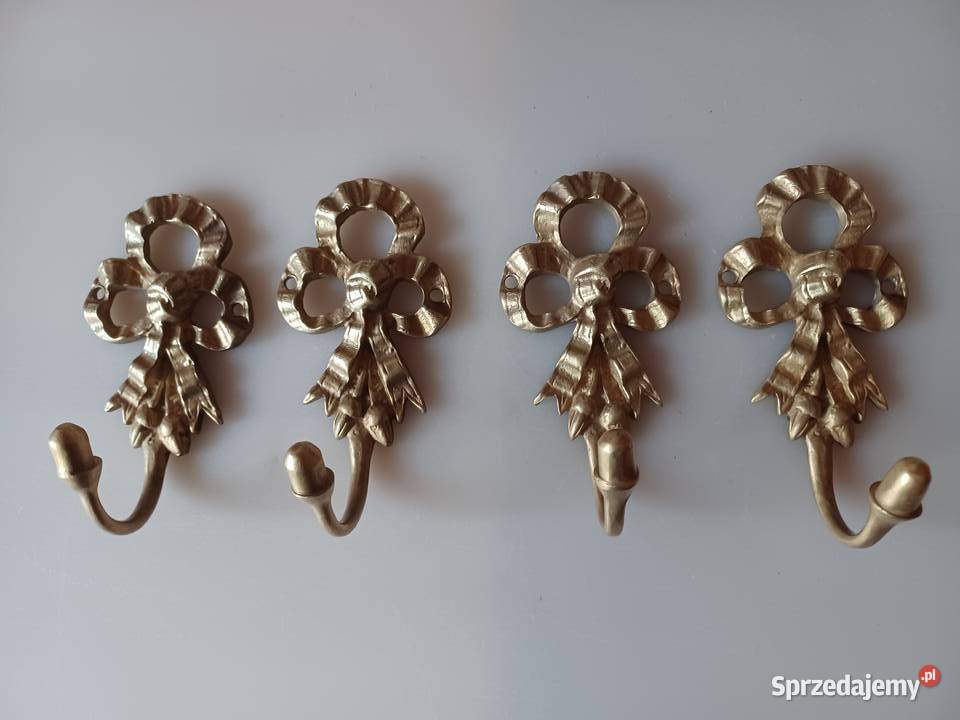 Komplet czterech pięknych mosiężnych wieszaków Poznań